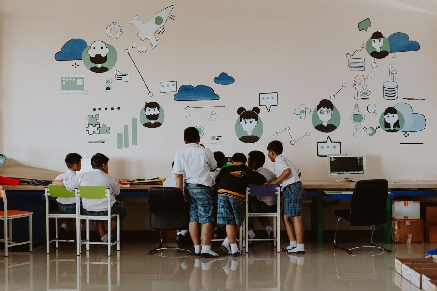 Students collaborating in a school computer lab
